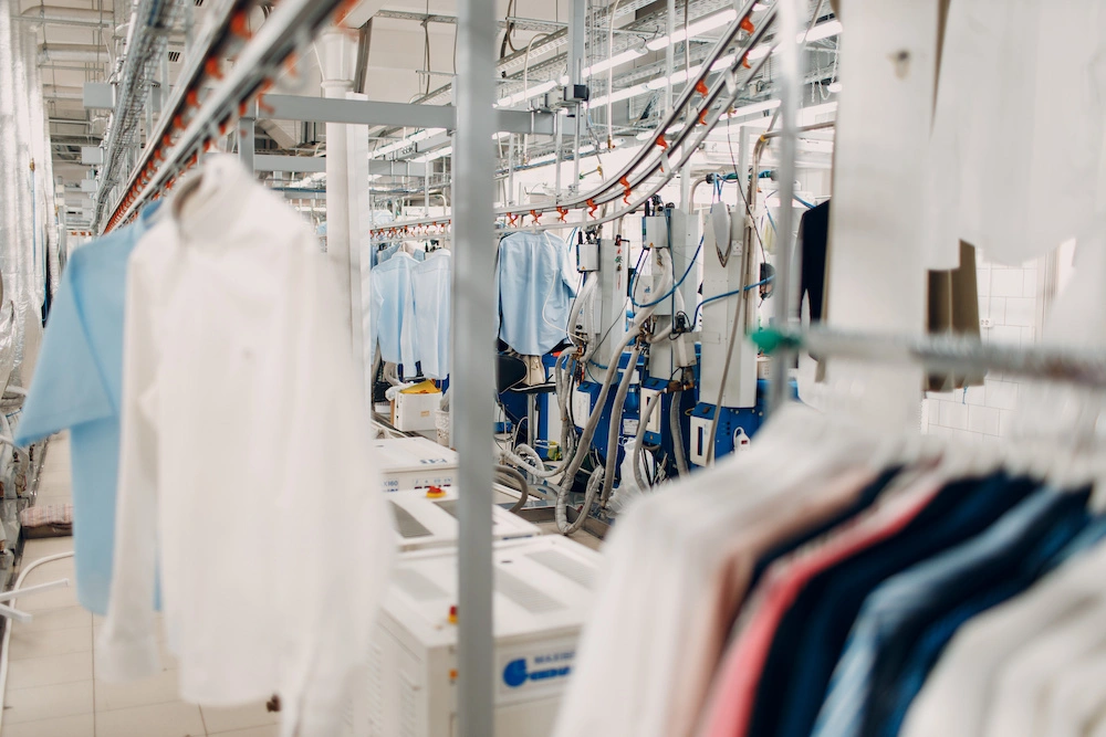 Dry cleaning clothes. Clean cloth chemical process. Laundry industrial dry-cleaning.